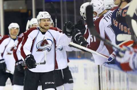 Feb 11, 2017; New York, NY, USA; Colorado Avalanche center John Mitchell (7) is congratulated by his teammates after scoring a goal against the New York Rangers during the second period at Madison Square Garden. Mandatory Credit: Andy Marlin-USA TODAY Sports