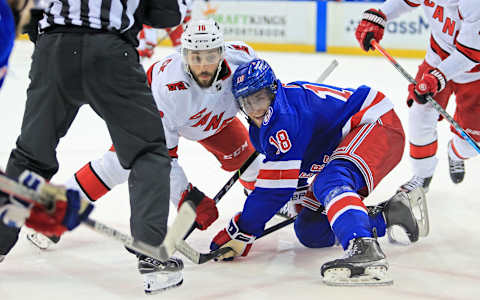 May 22, 2022; New York, New York, USA; Carolina Hurricanes center Vincent Trocheck (16) and New York Rangers center Andrew Copp (18) battle after a face-off during the third period in game three of the second round of the 2022 Stanley Cup Playoffs at Madison Square Garden. Mandatory Credit: Danny Wild-USA TODAY Sports