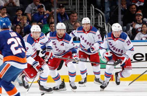 ELMONT, NEW YORK – OCTOBER 26: (L-R) Julien Gauthier #12, Barclay Goodrow #21, Libor Hajek #25, and Jimmy Vesey #26 of the New York Rangers skates against the New York Islanders during the first period at the UBS Arena on October 26, 2022, in Elmont, New York. (Photo by Bruce Bennett/Getty Images)