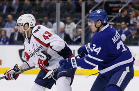 Apr 4, 2017; Toronto, Ontario, CAN; Toronto Maple Leafs forward Auston Matthews (34) checks Washington Capitals forward Tom Wilson (43) at the Air Canada Centre. Washington defeated Toronto 4-1. Mandatory Credit: John E. Sokolowski-USA TODAY Sports