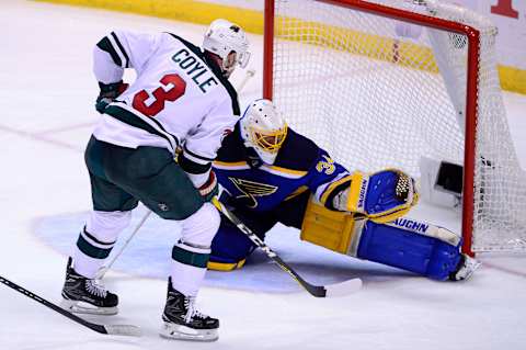 Apr 19, 2017; St. Louis, MO, USA; St. Louis Blues goalie Jake Allen (34) makes a save against Minnesota Wild center Charlie Coyle (3) during the third period in game four of the first round of the 2017 Stanley Cup Playoffs at Scottrade Center. The Wild won 2-0. Mandatory Credit: Jeff Curry-USA TODAY Sports