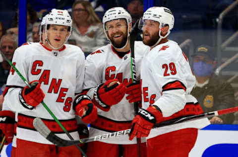 TAMPA, FLORIDA – OCTOBER 01: Derek Stepan #18 of the Carolina Hurricanes celebrates a goal during a preseason game against the Tampa Bay Lightning at Amalie Arena on October 01, 2021, in Tampa, Florida. (Photo by Mike Ehrmann/Getty Images)