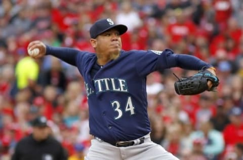 May 21, 2016; Cincinnati, OH, USA; Seattle Mariners starting pitcher Felix Hernandez (34) throws against the Cincinnati Reds during the second inning at Great American Ball Park. Mandatory Credit: David Kohl-USA TODAY Sports