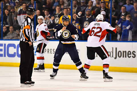 Nov 25, 2014; St. Louis, MO, USA; St. Louis Blues right wing Ryan Reaves (75) and Ottawa Senators defenseman Eric Gryba (62) square off during the second period at Scottrade Center. Mandatory Credit: Jasen Vinlove-USA TODAY Sports