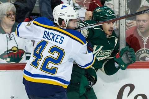 Apr 22, 2015; Saint Paul, MN, USA; St. Louis Blues forward David Backes (42) hits Minnesota Wild forward Zach Parise (11) during the third period in game three of the first round of the 2015 Stanley Cup Playoffs at Xcel Energy Center. The Blues defeated the Wild 6-1. Mandatory Credit: Brace Hemmelgarn-USA TODAY Sports