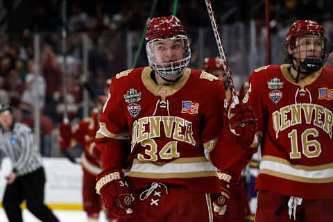 Apr 9, 2022; Boston, MA, USA; Denver forward Carter Mazur (34) celebrates a goal against Minnesota State during the third period of the 2022 Frozen Four college ice hockey national championship game at TD Garden. Mandatory Credit: Winslow Townson-USA TODAY Sports