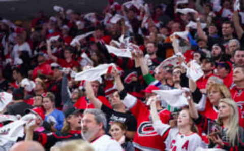 Food Jun 1, 2021; Raleigh, North Carolina, USA; Carolina Hurricanes fans cheer during the game against the Tampa Bay Lightning in game two of the second round of the 2021 Stanley Cup Playoffs at PNC Arena. Mandatory Credit: James Guillory-USA TODAY Sports