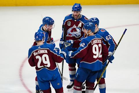 Jun 18, 2022; Denver, Colorado, USA; Colorado Avalanche players celebrate a goal against the Tampa Bay Lightning during the third period of game two of the 2022 Stanley Cup Final at Ball Arena. Mandatory Credit: Ron Chenoy-USA TODAY Sports