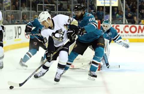 Mar 9, 2015; San Jose, CA, USA; Pittsburgh Penguins right wing Steve Downie (23) controls the puck ahead of San Jose Sharks defenseman Brent Burns (88) during the second period at SAP Center at San Jose. Mandatory Credit: Kelley L Cox-USA TODAY Sports