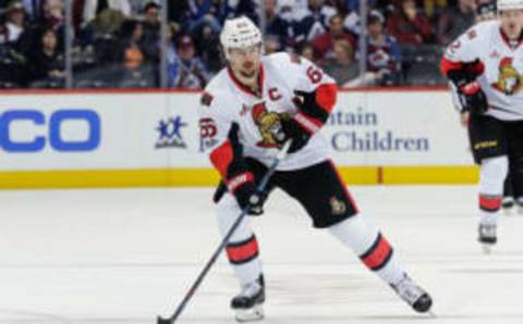 Mar 11, 2017; Denver, CO, USA; Ottawa Senators defenseman Erik Karlsson (65) controls the puck in the third period against the Colorado Avalanche at the Pepsi Center. The Senators won 4-2. Mandatory Credit: Isaiah J. Downing-USA TODAY Sports