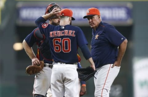 Jul 10, 2016; Houston, TX, USA; Houston Astros pitching coach Brent Strom (56) talks with starting pitcher Dallas Keuchel (60) during the sixth inning against the Oakland Athletics at Minute Maid Park. Mandatory Credit: Troy Taormina-USA TODAY Sports