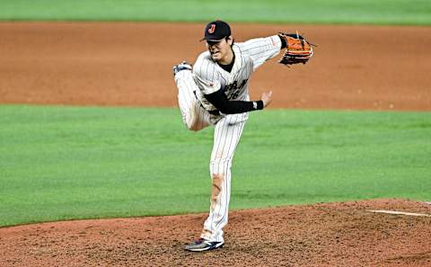 MIAMI, FLORIDA – MARCH 21: Shohei Ohtani #16 of Team Japan pitches in the top of the 9th inning during World Baseball Classic Championship between United States and Japan at loanDepot park on March 21, 2023 in Miami, Florida. (Photo by Gene Wang/Getty Images)