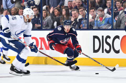 COLUMBUS, OH – APRIL 16: Braydon Coburn #55 of the Tampa Bay Lightning and Artemi Panarin #9 of the Columbus Blue Jackets skate after a loose puck during the first period in Game Four of the Eastern Conference First Round during the 2019 NHL Stanley Cup Playoffs on April 16, 2019 at Nationwide Arena in Columbus, Ohio. (Photo by Jamie Sabau/NHLI via Getty Images)