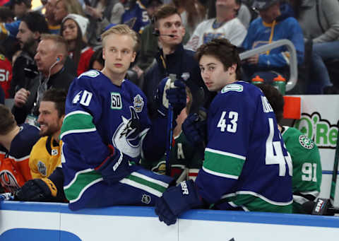 Elias Pettersson and Quinn Hughes of the Vancouver Canucks. (Photo by Bruce Bennett/Getty Images)