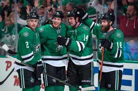 Mar 11, 2016; Dallas, TX, USA; Dallas Stars left wing Jamie Benn (14) and right wing Patrick Eaves (18) and center Tyler Seguin (91) and defenseman Kris Russell (2) celebrate a goal against the Chicago Blackhawks at the American Airlines Center. The Stars defeat the Blackhawks 5-2. Mandatory Credit: Jerome Miron-USA TODAY Sports