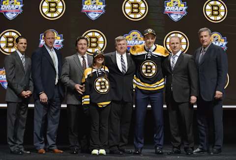 Jun 26, 2015; Sunrise, FL, USA; Zachary Senyshyn poses for a photo with team executives after being selected as the number fifteen overall pick to the Boston Bruins in the first round of the 2015 NHL Draft at BB&T Center. Mandatory Credit: Steve Mitchell-USA TODAY Sports