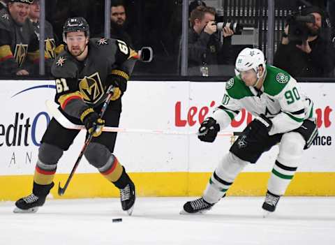 Mark Stone #61 of the Vegas Golden Knights passes the puck under pressure. (Photo by Ethan Miller/Getty Images)