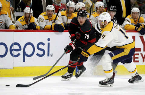 RALEIGH, NC – JANUARY 13: Micheal Ferland #79 of the Carolina Hurricanes and Mattias Ekholm #14 of the Nashville Predators battle for a loose puck during an NHL game on January 13 ,2019 at PNC Arena in Raleigh, North Carolina. (Photo by Gregg Forwerck/NHLI via Getty Images)