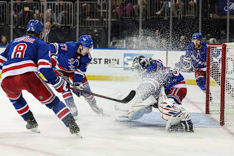 May 3, 2022; New York, New York, USA; New York Rangers goaltender Igor Shesterkin (31) makes a save in front of center Frank Vatrano (77) and defenseman Jacob Trouba (8) during the third period against the Pittsburgh Penguins in game one of the third round of the 2022 Stanley Cup Playoffs at Madison Square Garden. Mandatory Credit: Vincent Carchietta-USA TODAY Sports