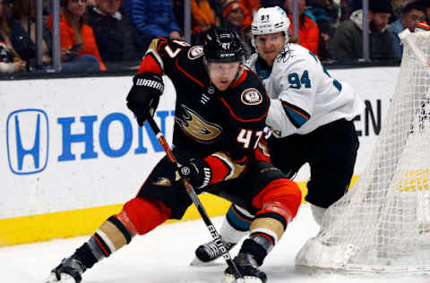 ANAHEIM, CALIFORNIA – FEBRUARY 22: Hampus Lindholm #47 of the Anaheim Ducks skates the puck against Alexander Barabanov #94 of the San Jose Sharks in the second period at Honda Center on February 22, 2022, in Anaheim, California. (Photo by Ronald Martinez/Getty Images)