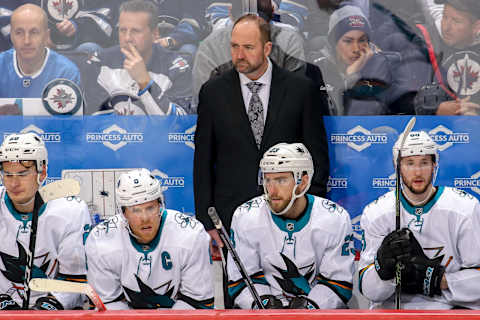 WINNIPEG, MB – MARCH 12: Head Coach Peter DeBoer of the San Jose Sharks looks on from the bench during second period action against the Winnipeg Jets at the Bell MTS Place on March 12, 2019 in Winnipeg, Manitoba, Canada. (Photo by Jonathan Kozub/NHLI via Getty Images)