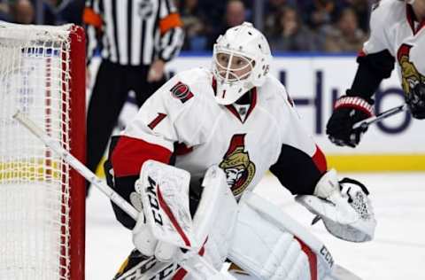 Nov 9, 2016; Buffalo, NY, USA; Ottawa Senators goalie Mike Condon (1) looks for the puck behind the net during the second period against the Buffalo Sabres at KeyBank Center. Mandatory Credit: Timothy T. Ludwig-USA TODAY Sports