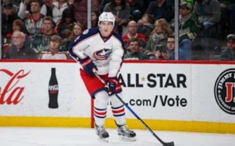 Dec 31, 2016; Saint Paul, MN, USA; Columbus Blue Jackets defenseman Zach Werenski (8) skates with the puck in the second period against the Minnesota Wild at Xcel Energy Center. Mandatory Credit: Brad Rempel-USA TODAY Sports