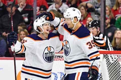 RALEIGH, NORTH CAROLINA – FEBRUARY 16: Kailer Yamamoto #56 celebrates with teammate Alex Chiasson #39 of the Edmonton Oilers after scoring a goal against the Carolina Hurricanes during the second period of their game at PNC Arena on February 16, 2020 in Raleigh, North Carolina. (Photo by Grant Halverson/Getty Images)