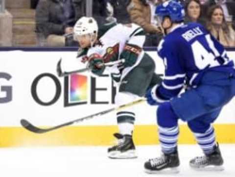 Mar 3, 2016; Toronto, Ontario, CAN; Minnestoa Wild right wing Jason Pominville (29) takes a slap shot past Toronto Maple Leaf defenceman Morgan Rielly (44) in the third period at Air Canada Centre. The Wild won 2-1. Mandatory Credit: Dan Hamilton-USA TODAY Sports