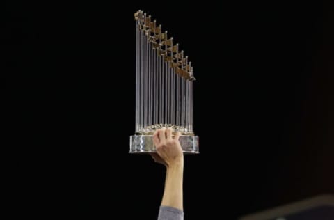 LOS ANGELES, CA – NOVEMBER 01: A member of the Houston Astros holds the Commissioner’s Trophy after defeating the Los Angeles Dodgers 5-1 in game seven to win the 2017 World Series at Dodger Stadium on November 1, 2017 in Los Angeles, California.