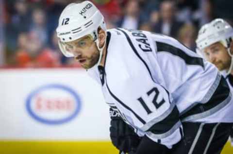 Feb 28, 2017; Calgary, Alberta, CAN; Los Angeles Kings right wing Marian Gaborik (12) during the face off against the Calgary Flames during the third period at Scotiabank Saddledome. Calgary Flames won 2-1. Mandatory Credit: Sergei Belski-USA TODAY Sports