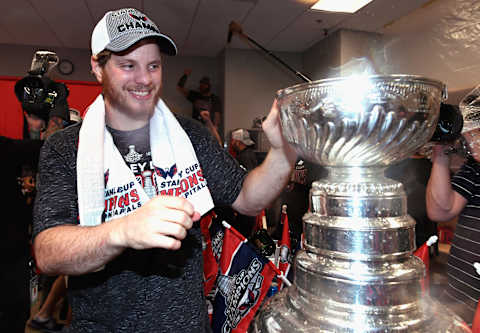 LAS VEGAS, NV – JUNE 07: John Carlson #74 of the Washington Capitals celebrates with the Stanley Cup in the locker room after his team defeated the Vegas Golden Knights 4-3 in Game Five of the 2018 NHL Stanley Cup Final at T-Mobile Arena on June 7, 2018 in Las Vegas, Nevada. The Capitals won the series 4-1. (Photo by Patrick McDermott/NHLI via Getty Images)