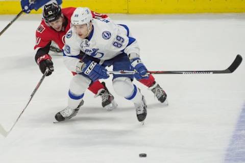 Feb 8, 2016; Ottawa, Ontario, CAN; Ottawa Senators left wing Shane Prince (10) and Tampa Bay Lightning defenseman Nikita Nesterov (89) battle for the puck in the third period at the Canadian Tire Centre. The Senators won 5-1. Mandatory Credit: Marc DesRosiers-USA TODAY Sports