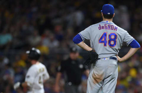 PITTSBURGH, PA – JULY 28: Jacob deGrom #48 of the New York Mets reacts after allowing a single to Jordan Luplow #47 of the Pittsburgh Pirates in the seventh inning during the game at PNC Park on July 28, 2018 in Pittsburgh, Pennsylvania. (Photo by Justin Berl/Getty Images)