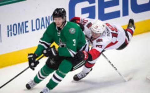 Dallas Stars defenseman John Klingberg (3) and Ottawa Senators left wing Ryan Dzingel (18) chase the puck (Jerome Miron-USA TODAY Sports)