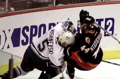 Anaheim, CA: Calgary Flames vs Mighty Ducks of Anaheim at the Pond. (left) Vitaly Vishnevski (5) of the Ducks and Rob Niedermayer (44) of the Flames (right) collide after going for the puck during their game at the Pond in Anaheim. (Photo by Robert Lachman/Los Angeles Times via Getty Images)