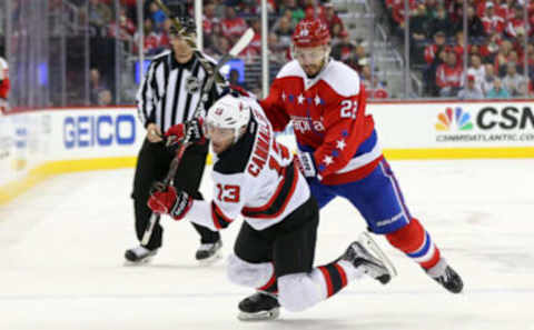 Mar 2, 2017; Washington, DC, USA; Washington Capitals defenseman Kevin Shattenkirk (22) checks New Jersey Devils left wing Michael Cammalleri (13) while battling for the puck in the third period at Verizon Center. The Capitals won 1-0. Mandatory Credit: Geoff Burke-USA TODAY Sports