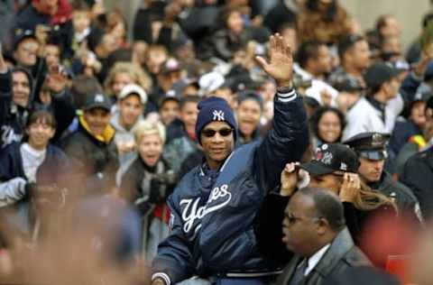 23 Oct 1998: Outfielder Darryl Strawberry of the New York Yankees celebrates during a ticker-tape parade held after the Yankees defeated the San Diego Padres in four games to win the World Series in New York City, New York.