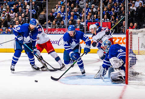 TORONTO, ON - OCTOBER 21: Tyson Barrie #94 of the Toronto Maple Leafs defends with Jake Muzzin #8 and Frederik Andersen #31 of the Toronto Maple Leafs against the Columbus Blue Jackets during the second period at the Scotiabank Arena on October 21, 2019 in Toronto, Ontario, Canada. (Photo by Mark Blinch/NHLI via Getty Images)