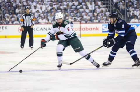 WINNIPEG, MB April 20: Minnesota Wild defenseman Ryan Murphy (6) tries to skate away from Winnipeg Jets forward Andrew Copp (9) during the Stanley Cup Playoffs First Round Game 5 between the Winnipeg Jets and the Minnesota Wild on April 20, 2018 at the Bell MTS Place in Winnipeg MB. (Photo by Terrence Lee/Icon Sportswire via Getty Images)