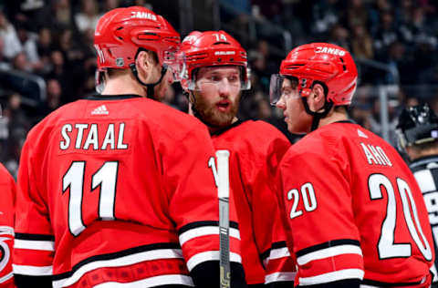 LOS ANGELES, CA – DECEMBER 2: Jordan Staal #11, Jaccob Slavin #74 and Sebastian Aho #20 of the Carolina Hurricanes talk while waiting for play to begin during the second period of the game against the Los Angeles Kings at STAPLES Center on December 2, 2018 in Los Angeles, California. (Photo by Juan Ocampo/NHLI via Getty Images)