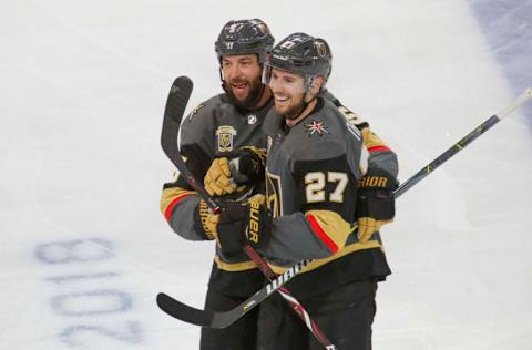 LAS VEGAS, NV – APRIL 11: Shea Theodore #27 celebrates his goal with teammate Deryk Engelland #5 of the Vegas Golden Knights against the Los Angeles Kings in Game One of the Western Conference First Round during the 2018 NHL Stanley Cup Playoffs at T-Mobile Arena on April 11, 2018, in Las Vegas, Nevada. (Photo by Jeff Speer/NHLI via Getty Images)