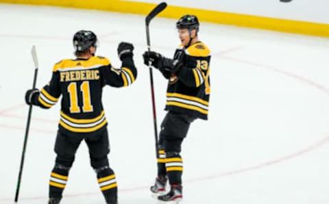 Jan 23, 2021; Boston, Massachusetts, USA; Boston Bruins center Charlie Coyle (13) celebrates after scoring a goal during the second period against the Philadelphia Flyers at TD Garden. Mandatory Credit: Paul Rutherford-USA TODAY Sports