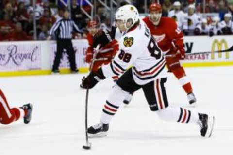 Mar 2, 2016; Detroit, MI, USA; Chicago Blackhawks right wing Patrick Kane (88) takes a shot and scores in the second period against the Detroit Red Wings at Joe Louis Arena. Mandatory Credit: Rick Osentoski-USA TODAY Sports