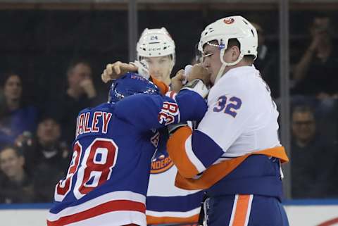 Micheal Haley #38 of the New York Rangers and Ross Johnston #32 of the New York Islanders fight