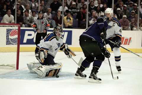 11 Oct 2000: Roman Turek #1 of the St. Louis Blues protects the goal from Luc Rubitaille #20 of the Los Angeles Kings during the game at the Staples Center in Los Angeles, California. The Blues tied the Kings 4-4.Mandatory Credit: Kellie Landis /Allsport