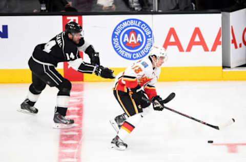 22 December 2014: Calgary Flames Left Wing Johnny Gaudreau (13) [9261] tries to break away from Los Angeles Kings Right Wing Justin Williams (14) [2150] during an NHL game between the Calgary Flames and the Los Angeles Kings at STAPLES Center in Los Angeles, CA. (Photo by Chris Williams/Icon Sportswire via Getty Images)