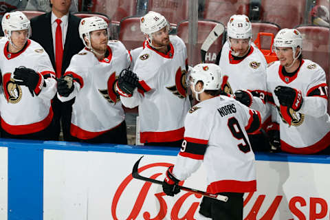 Teammates congratulate Josh Norris #9 of the Ottawa Senators (Photo by Joel Auerbach/Getty Images)