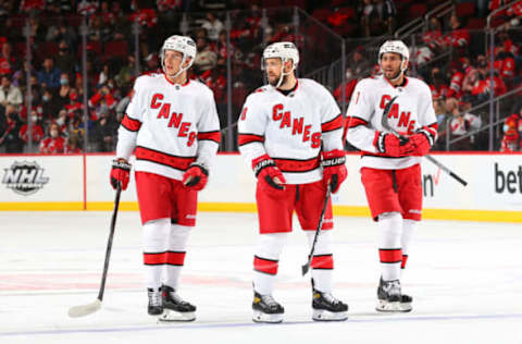 NEWARK, NJ – JANUARY 22: Jesperi Kotkaniemi #82 of the Carolina Hurricanes, Derek Stepan #18 of the Carolina Hurricanes, and Josh Leivo #41 of the Carolina Hurricanes during the National Hockey League game between the New Jersey Devils and the Carolina Hurricanes on January 22, 2022, at the Prudential Center in Newark, New Jersey. (Photo by Rich Graessle/Getty Images)