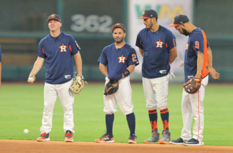 Apr 28, 2017; Houston, TX, USA; (L to R) Houston Astros third baseman Alex Bregman (2) second baseman Jose Altuve (27) shortstop Carlos Correa (1) and first baseman Marwin Gonzalez (9) prior to the game against the Oakland Athletics at Minute Maid Park. Mandatory Credit: Erik Williams-USA TODAY Sports